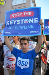 Protester holds a 'Stop the Keystone XL Pipeline' sign
